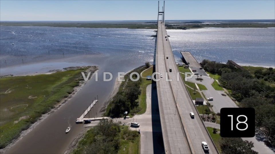 CLIP 18 - Brunswick, GA aerial turn while focusing in Sydney Lanier Bridge and boat landing