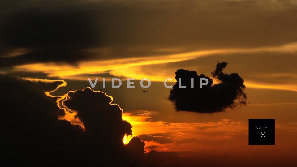 CLIP 18 - New Orleans, LA Golden sunset with airplane flying by clouds