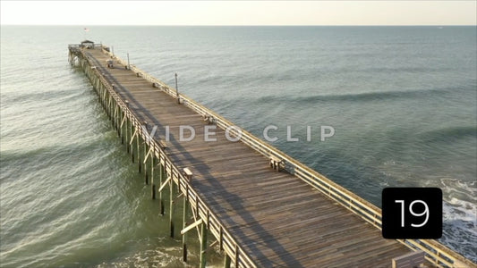 CLIP 19 - Pawleys Island, SC fishermen reaching end of pier at early morning