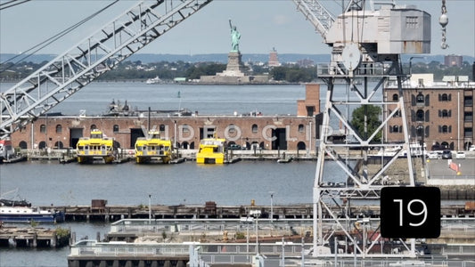 CLIP 19 - New York, NY Vol 2. - aerial rising up past shipping cranes on Staten Island to view Statue of Liberty