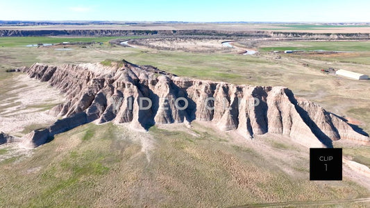 CLIP 1 - Badlands, SD close drone flight over Butte on mixed grass prairie