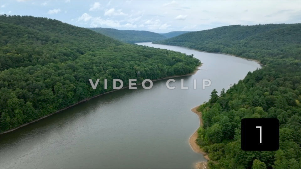 CLIP 1 - Landscape with Allegheny River flowing by green mountain wilderness in National Forest in Pennsylvania