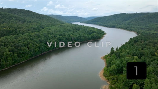 CLIP 1 - Landscape with Allegheny River flowing by green mountain wilderness in National Forest in Pennsylvania