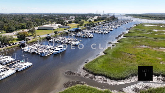 CLIP 1 - Brunswick, GA rising above inlet marsh to reveal marina and public park