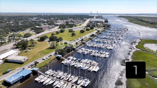 CLIP 1 - Brunswick, GA rising above inlet marsh to reveal marina and public park