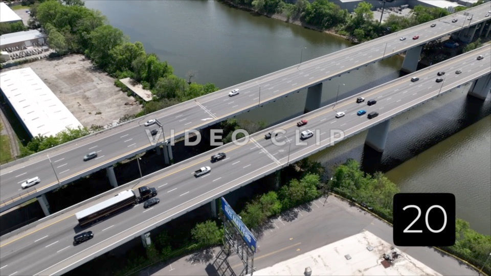 CLIP 20 - Nashville, TN traffic on highway crossing over industrial area and river