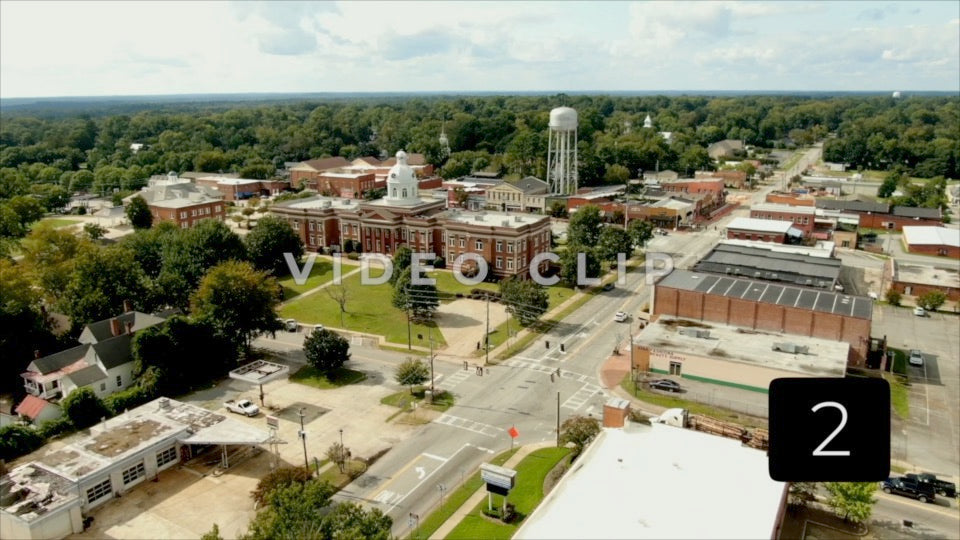 CLIP 2 - Eatonton, GA  - Putnam County Clerk of Courts - aerial lowering down behind downtown buildings