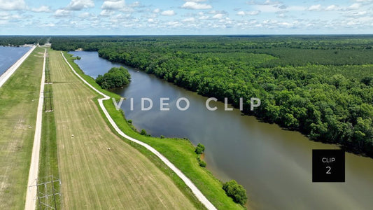 Stock video CLIP 2 - Lake Marion, SC flock of birds flying over canal behind earthen dam wall