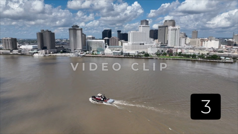 CLIP 3 - New Orleans, LA Vol. 1 - tug boat on Mississippi river passing by city skyline