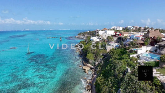 CLIP 3 - Isla Mujeras, Mexico rising up from cliffside to reveal coastal vacation homes