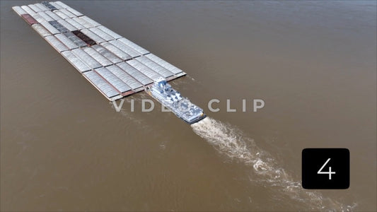 CLIP 4 - Memphis, TN Tug boat transports coal on barges up Mississippi River