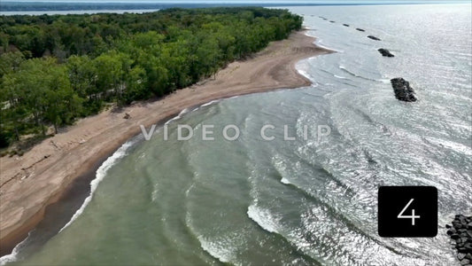 CLIP 4 -  Erie, PA Presque Isle State Park waves breaking on beach in later afternoon sunshine