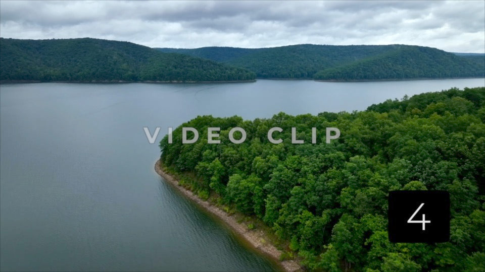 CLIP 4 - Aerial flight over green trees towards Kinzua Dam reservoir in Allegheny National Forest
