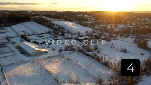CLIP 4 - Winter Vol. 2 - Flying over horse farm during winter with snow at sunset