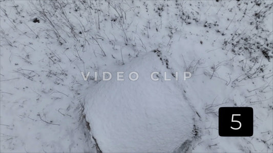 CLIP 5 - Winter Vol. 1 - Looking down on snow covered hay bale in pasture