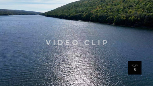 Stock video CLIP 5 - Canadice Lake, NY aerial of peaceful water with sunlight