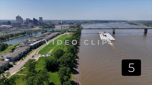 CLIP 5 - Memphis, TN city skyline with Boat pushing barges on Mississippi River