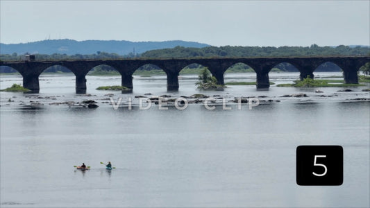 CLIP 5 - Harrisburg, PA kayakers paddle Susquehanna River in front of train bridge
