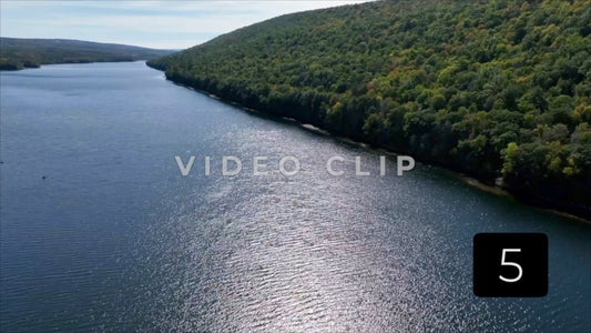 CLIP 5 - Canadice Lake, NY aerial of peaceful water with sunlight
