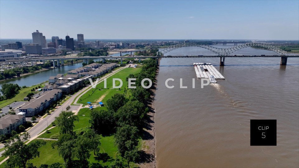 CLIP 5 - Memphis, TN city skyline with Boat pushing barges on Mississippi River