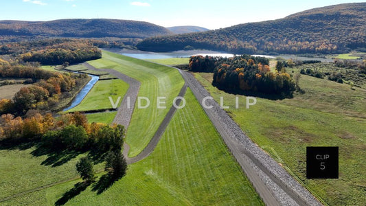 CLIP 5 - Tioga-Hammond Lakes, PA flying over green levee towards reservoir Dam