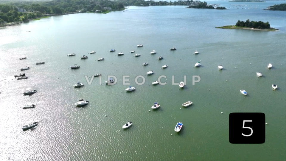CLIP 5 - Boston, MA boats moored in harbor in late afternoon sunshine with view of islands