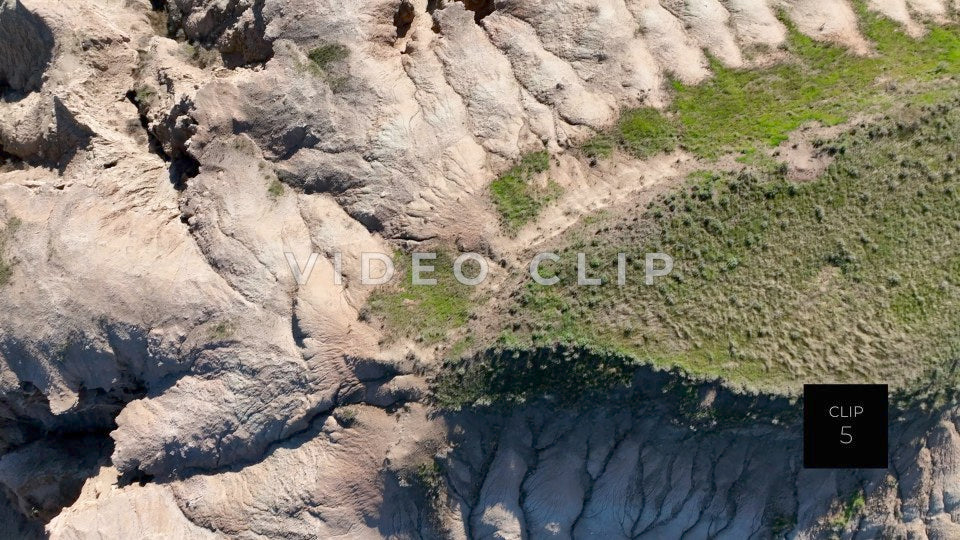 CLIP 5 - Badlands, SD close drone flight over Butte top to observe erosion