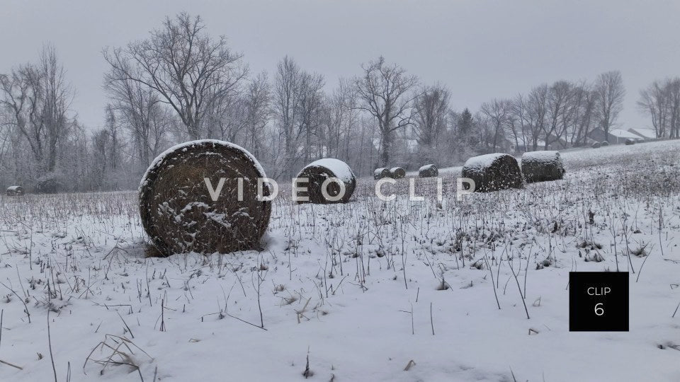 CLIP 6 - Slow side movement with hay bales in snow covered field during Winter