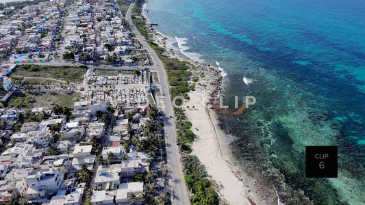 CLIP 6 - Isla Mujeras, Mexico aerial flight along coast over road and vacation homes