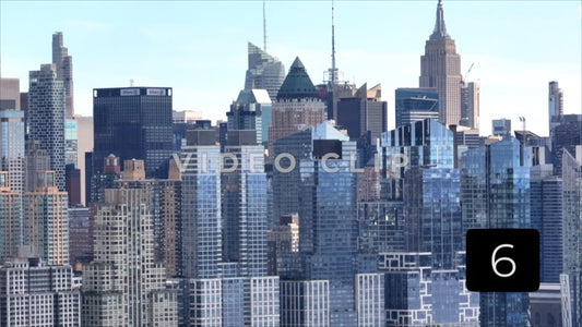 CLIP 6 - New York, NY Vol 2. - Telephoto view of glass office towers with cars driving by along Hudson River
