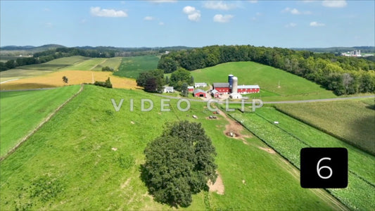 CLIP 6 - Farm house and pastures with green rolling hills in New York State countryside