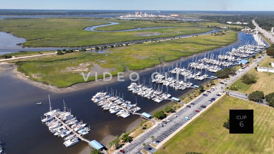 CLIP 6 - Brunswick, GA aerial rising up over public park to reveal marina and wetlands