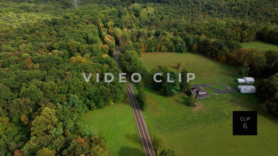CLIP 6 - Ohiopyle, PA car travels past mountain top home and green pastures