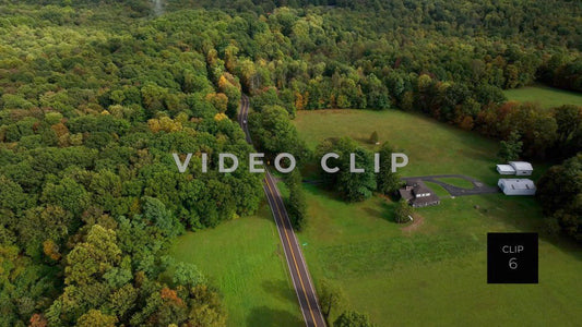 CLIP 6 - Ohiopyle, PA car travels past mountain top home and green pastures