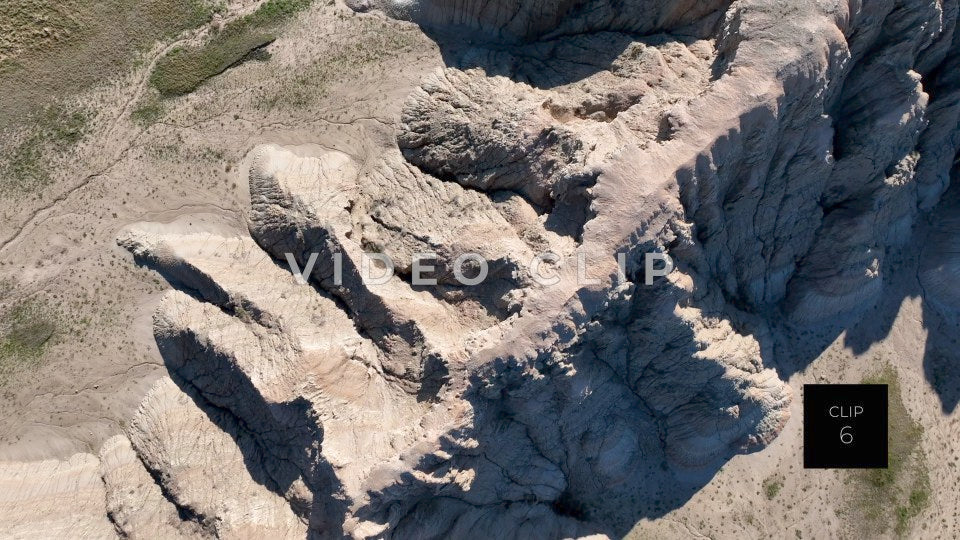 CLIP 6 - Badlands, SD flying over top of Butte while looking down on formations