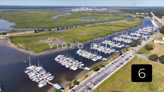 CLIP 6 - Brunswick, GA aerial rising up over public park to reveal marina and wetlands