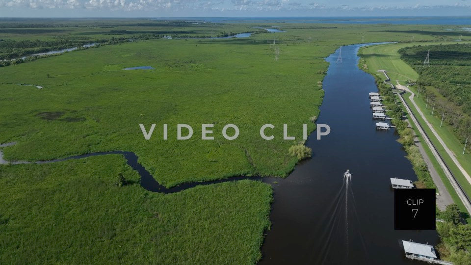 CLIP 7 - New Orleans, LA Segnette bayou boat motoring past houses