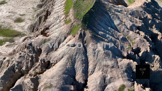 CLIP 7 - Badlands, SD close flight by Butte mountain side then pulling up to reveal top