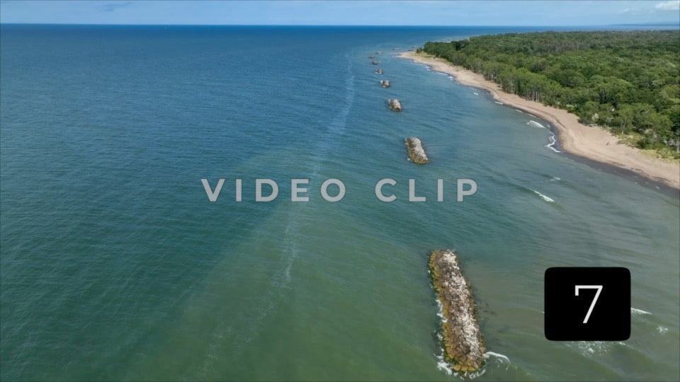 CLIP 7 -  Erie, PA Presque Isle State Park low flight over rocky jetties that protect shoreline
