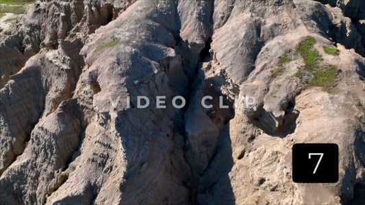 CLIP 7 - Badlands, SD close flight by Butte mountain side then pulling up to reveal top
