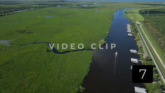 CLIP 7 - New Orleans, LA Segnette bayou boat motoring past houses