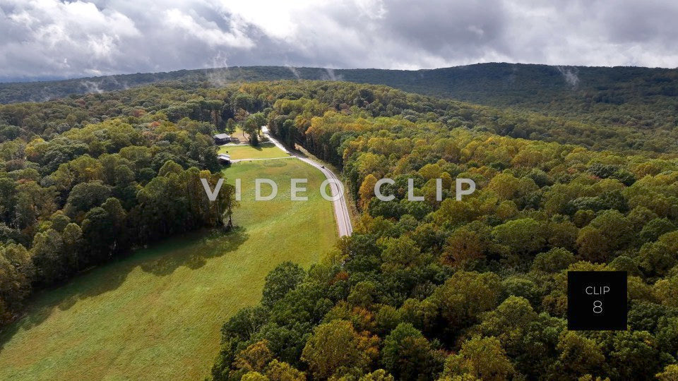 CLIP 8 - Ohiopyle, PA rain clouds pass over mountain top home as car drives by