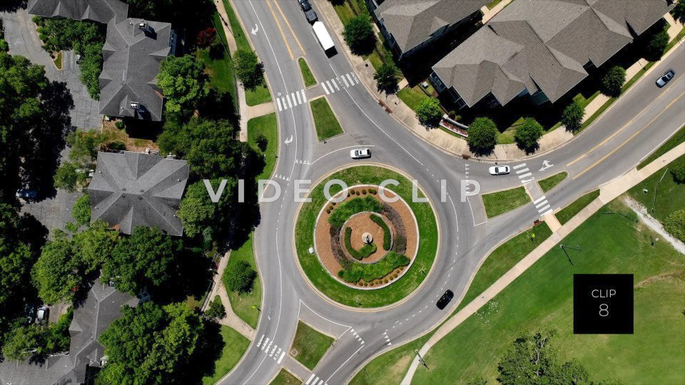 CLIP 8 - Memphis, TN cars driving on round about past neighborhood