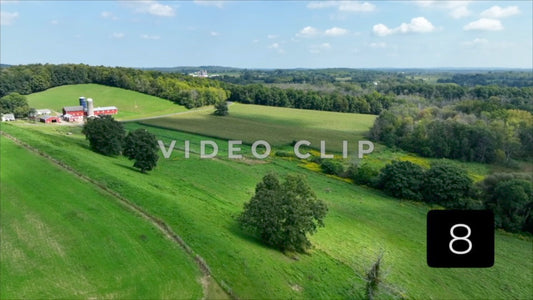 CLIP 8 - Flying over Gazebo in foreground towards Farm house and green pasture New York State countryside