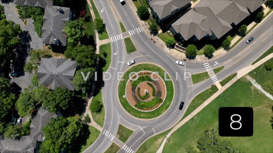 CLIP 8 - Memphis, TN cars driving on round about past neighborhood