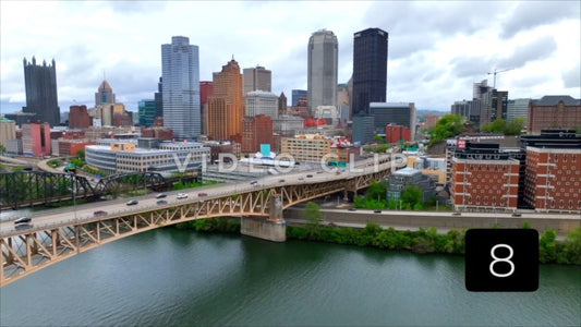 CLIP 8 - Pittsburgh, PA Vol. 2 - city skyline and turn to focus on cars traveling across bridge