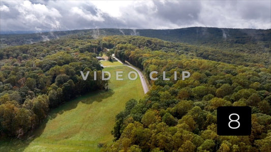 CLIP 8 - Ohiopyle, PA rain clouds pass over mountain top home as car drives by