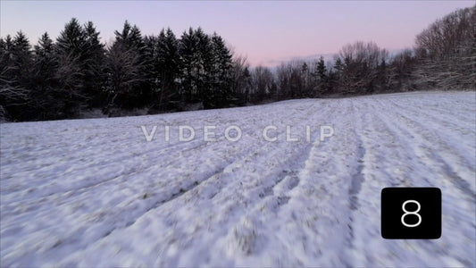 CLIP 8 - Winter Vol. 2 - Flying low over Winter field with snow