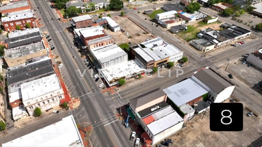 CLIP 8 - Selma, AL slow aerial twist over city streets and buildings downtown