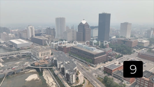 CLIP 9 - Rochester, NY Vol. 8 - Aerial flying towards office towers as Canadian wildfire smoke hovers over city